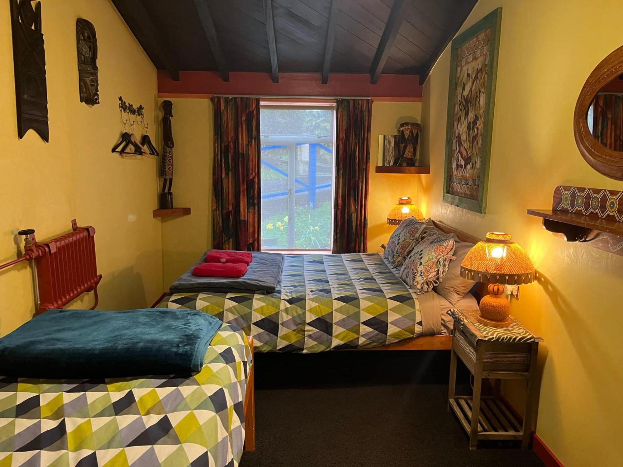 Global Village Travellers Lodge Greymouth Kültér fotó The bedroom at the Old School House